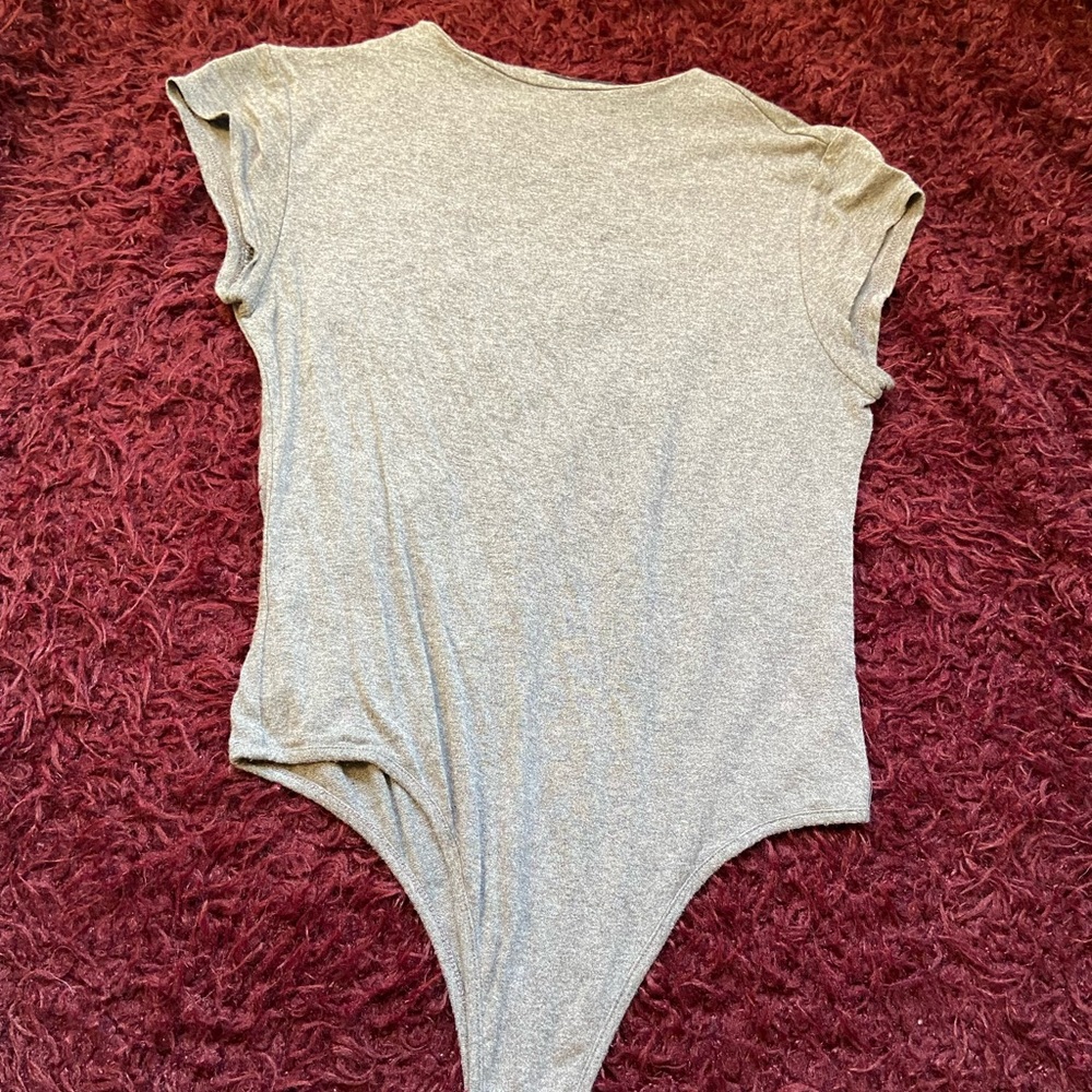Grey body suit with no collar